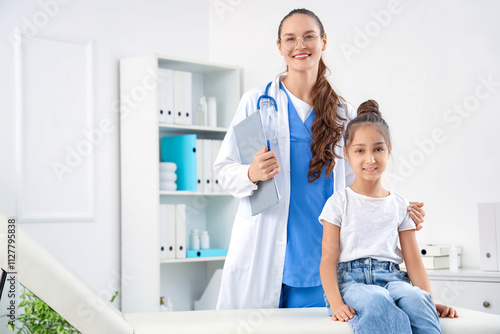 Female pediatrician with li...