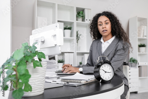 Alarm clock on table agains...