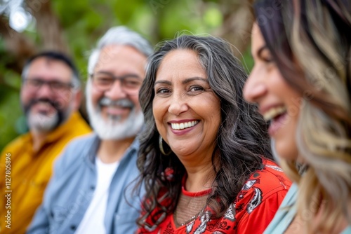 Portrait of a smiling senior couple with their family in the background