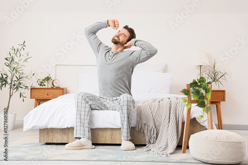Happy young man stretching ...