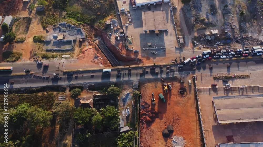 High angle view of a large traffic jam due to roadside construction in Abuja, Nigeria on a sunny morning