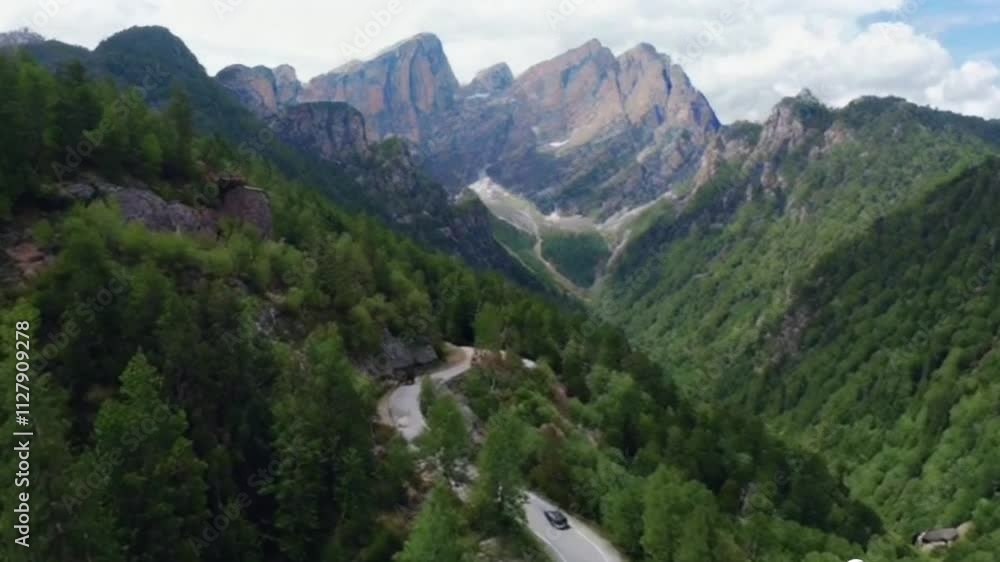 Stunning mountain in the alps seen closely with rocks video, green pastures and stream video Stunning mountain in the alps seen closely with rocks video, green pastures and stream video