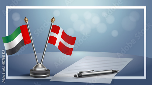United Arab Emirate and Denmark National flags on small table with bokeh background, cooperative relationship