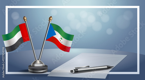 United Arab Emirate and Equatorial Guinea National flags on small table with bokeh background, cooperative relationship