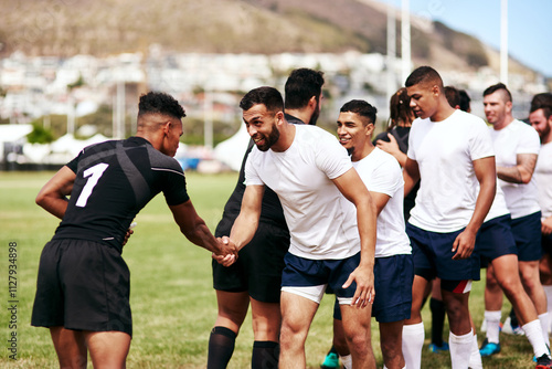 Rugby, team and handshake for greeting, introduction or sportsmanship on grass field outdoors. Sports men shaking hands and welcome for game rival, competition or training with workout and exercise