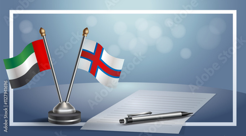 United Arab Emirate and Faroe Islands National flags on small table with bokeh background, cooperative relationship