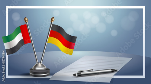 United Arab Emirate and Germany National flags on small table with bokeh background, cooperative relationship