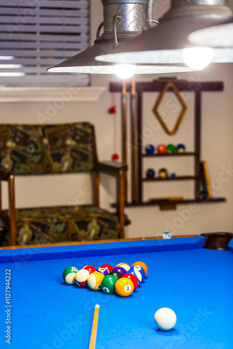 Billiards table and balls on a blue table. photo