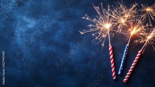 sparkler fireworks on blue background for 4th of july independence day celebration