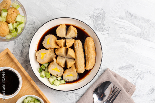 Pempek or Indonesian fish cake. Made from fish and flour. served with cuko. originated from palembang, sumatera. Perfect for recipe, article, catalogue, photo illustration, or any commercial purposes. photo