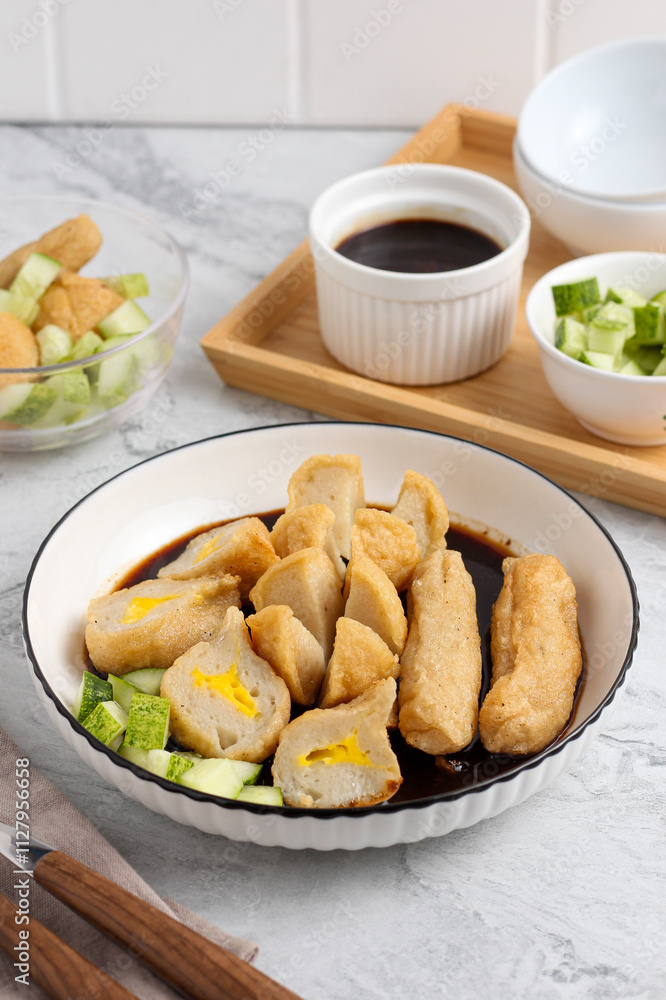 Pempek or Indonesian fish cake. Made from fish and flour. served with cuko. originated from palembang, sumatera. Perfect for recipe, article, catalogue, photo illustration, or any commercial purposes. Pempek or Indonesian fish cake. Made from fish and flour. served with cuko. originated from palembang, sumatera. Perfect for recipe, article, catalogue, photo illustration, or any commercial purposes.