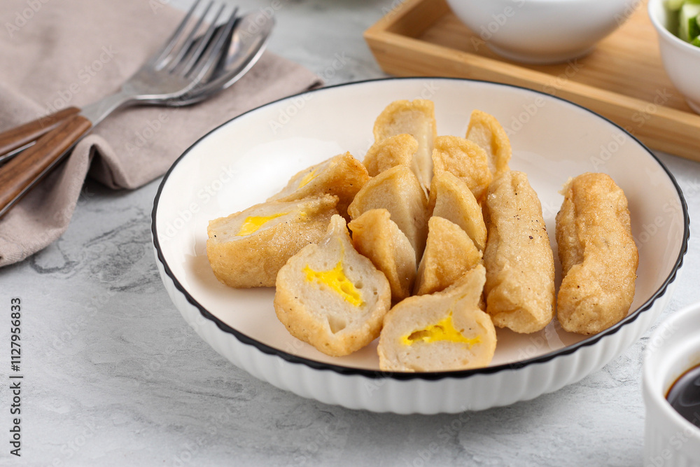 Pempek or Indonesian fish cake. Made from fish and flour. served with cuko. originated from palembang, sumatera. Perfect for recipe, article, catalogue, photo illustration, or any commercial purposes. Pempek or Indonesian fish cake. Made from fish and flour. served with cuko. originated from palembang, sumatera. Perfect for recipe, article, catalogue, photo illustration, or any commercial purposes.