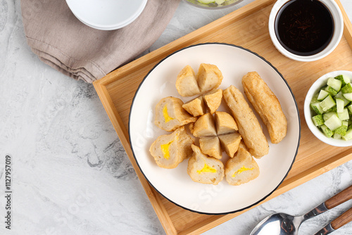 Pempek or Indonesian fish cake. Made from fish and flour. served with cuko. originated from palembang, sumatera. Perfect for recipe, article, catalogue, photo illustration, or any commercial purposes. photo