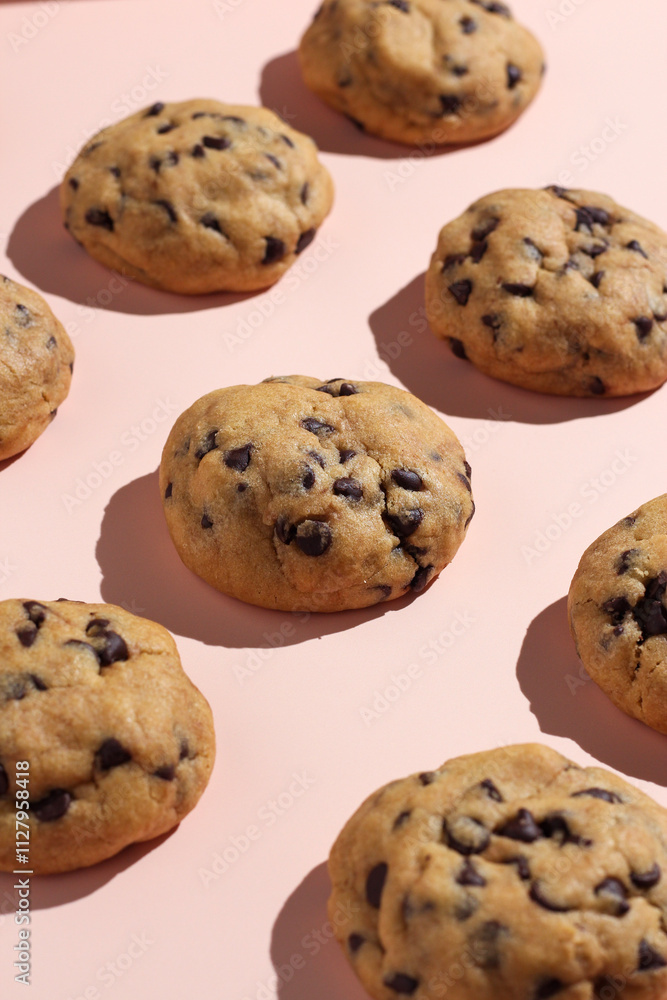 Chocolate soft cookies pattern on a pastel color background. Perfect for recipe, article, or any commercial purposes. Chocolate soft cookies pattern on a pastel color background. Perfect for recipe, article, or any commercial purposes.