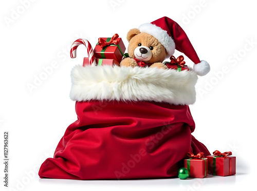 Classic Santa Claus sack overflowing with toys and gifts, including a teddy bear and candy cane, isolated on white