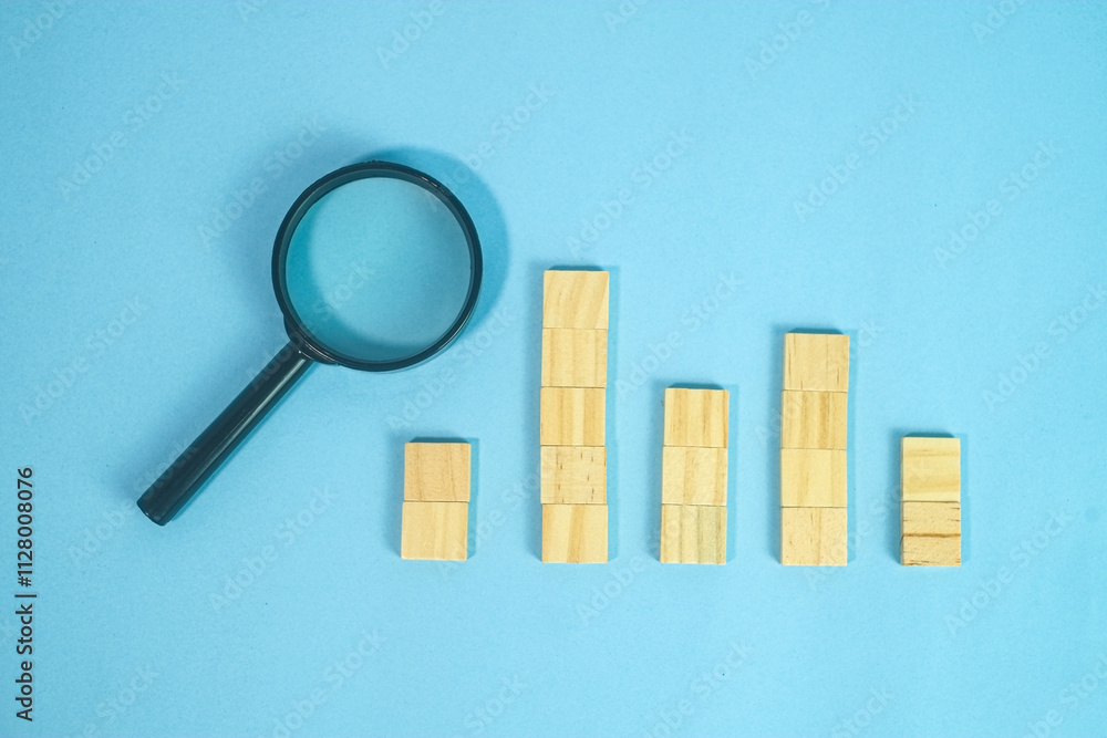 wooden block statistic concept with magnifying glass wooden block statistic concept with magnifying glass