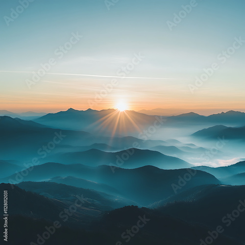 Serene mountain landscape at sunrise with misty valleys and peaks