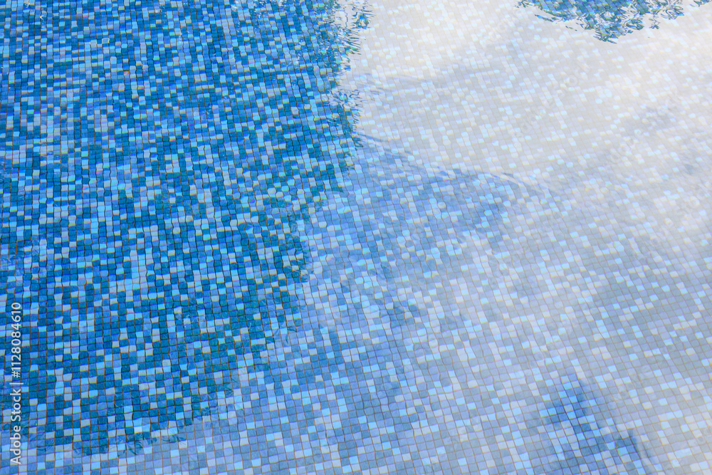 Swimming pool water surface and ripple wave with blue mosaic tiles Swimming pool water surface and ripple wave with blue mosaic tiles