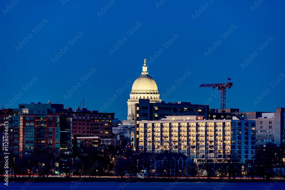 Downtown Madison, WI and the Wisconsin State Capitol Building behind Lake Monona at Twilight