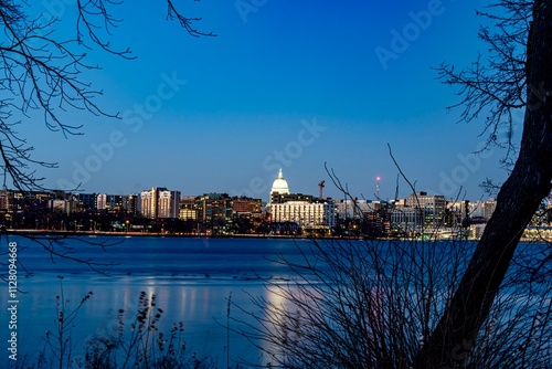 Downtown Madison, WI and the Wisconsin State Capitol Building behind Lake Monona at Twilight