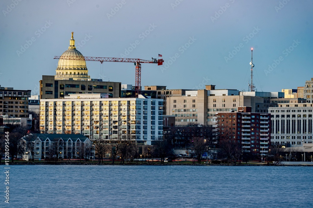 Downtown Madison, WI and the Wisconsin State Capitol Building behind Lake Monona at Twilight