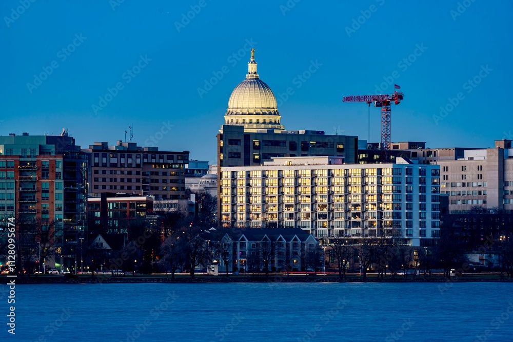 Downtown Madison, WI and the Wisconsin State Capitol Building behind Lake Monona at Twilight