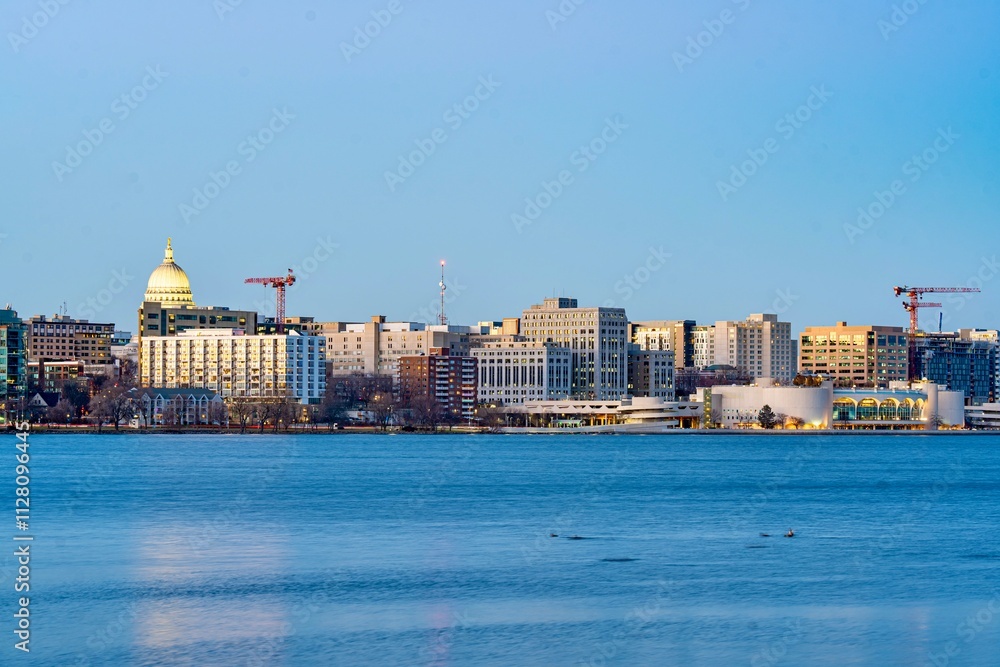 Downtown Madison, WI and the Wisconsin State Capitol Building behind Lake Monona at Twilight