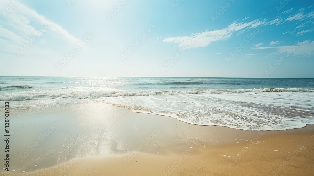 Beautiful Sandy Beach with Soft Blue Ocean Wave, Golden Sand, Gentle Ripple, Ideal Place for Relaxation and Enjoying the Seaside Scenery.