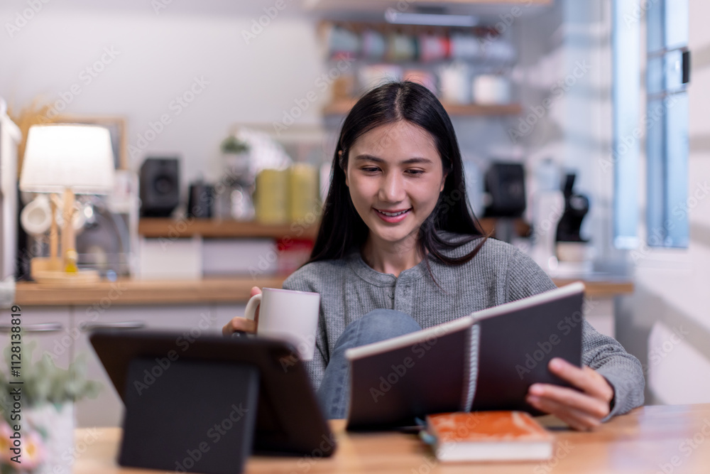 Fototapeta premium Female business freelancer asian person using digital tablet and laptop or remote working at home office,