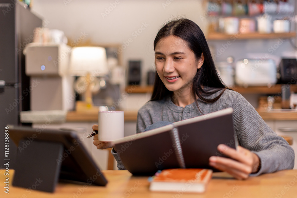 Female business freelancer asian person using digital tablet and laptop or remote working at home office, Female business freelancer asian person using digital tablet and laptop or remote working at home office,