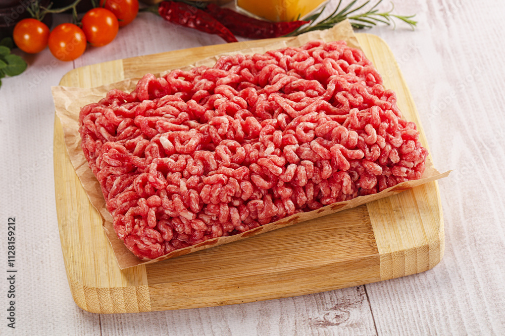 Raw minced beef meat over board Raw minced beef meat over board
