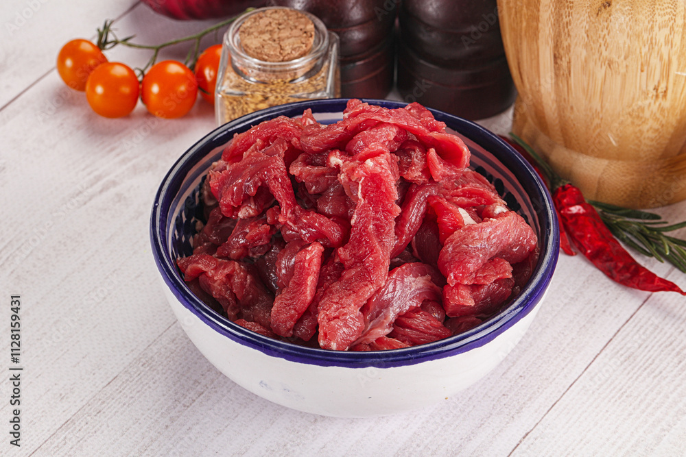 Raw beef meat - sliced strips Raw beef meat - sliced strips