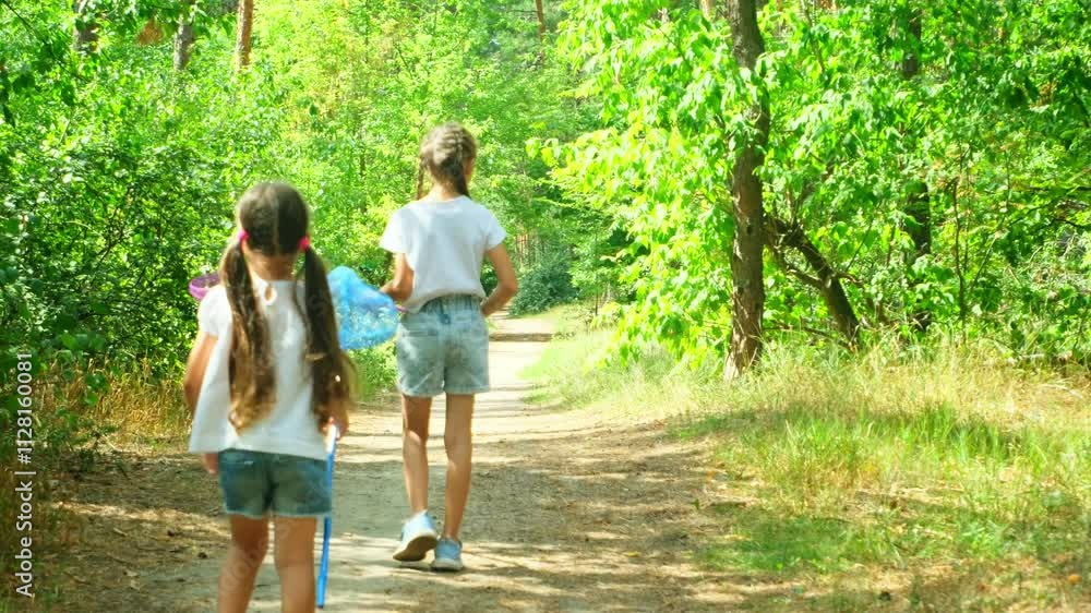On forest children run around with nets, trying to catch butterflies and grasshoppers. They run, jump, fool around. They are having fun. Summer, outdoors, in the forest. Holidays with children On forest children run around with nets, trying to catch butterflies and grasshoppers. They run, jump, fool around. They are having fun. Summer, outdoors, in the forest. Holidays with children