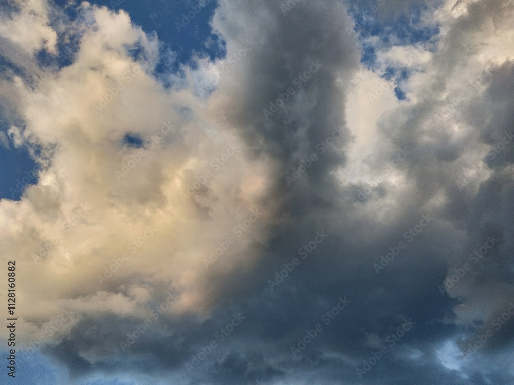 Dusk and dawn dramatic clouds float in the evening golden hour Dusk and dawn dramatic clouds float in the evening golden hour