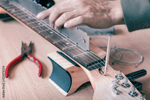 guitar repair, adjustment concept