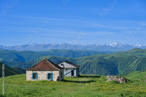 Abandoned shepherd houses with mountain landscape