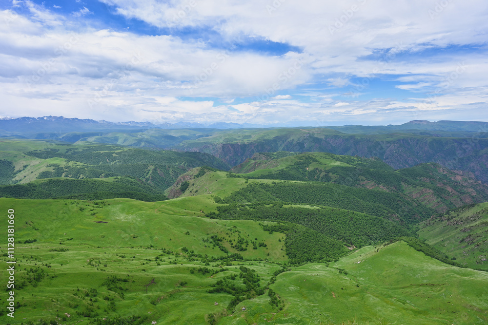 Green mountain valley landscape from the Kanjol plateau Green mountain valley landscape from the Kanjol plateau