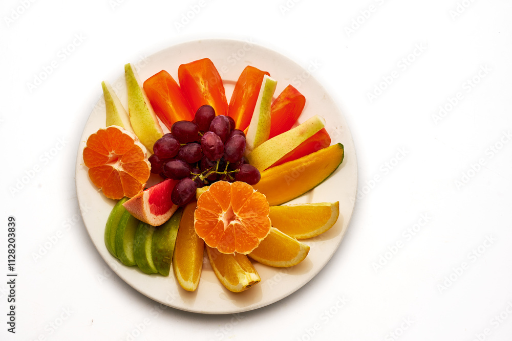 A plate of fruit with a variety of colors including oranges, apples, and grapes A plate of fruit with a variety of colors including oranges, apples, and grapes