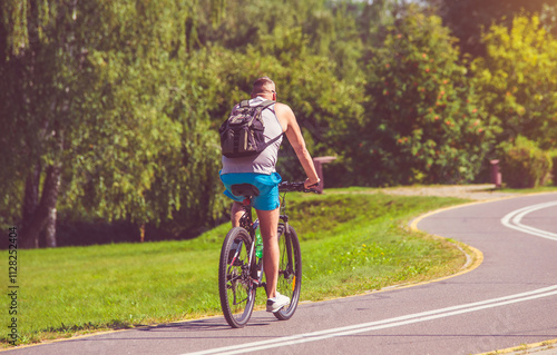 Cyclist ride on the bike path in the city Park 