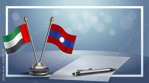 United Arab Emirate and Laos National flags on small table with bokeh background, cooperative relationship