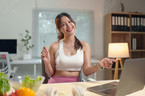 Young Asian woman live chatting, video calling on laptop computer, how to lose weight with diet. Introducing useful fruits and vegetables Lifestyle Influencer Healthy concept, lifestyle.