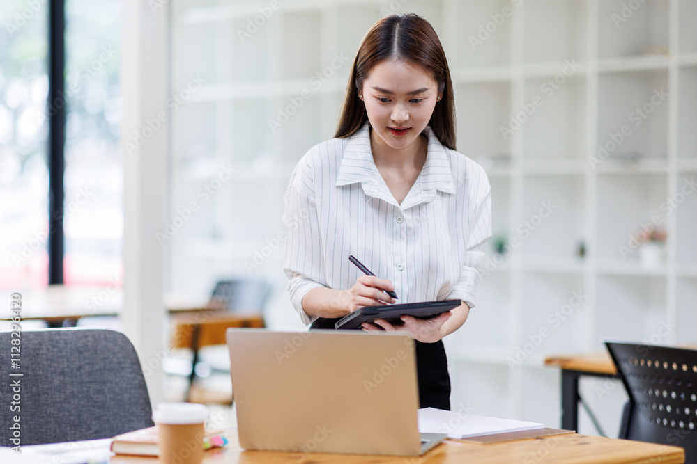 Happy young business asian woman with blank copy space area for text or slogan,Closeup portrait of beautiful Asian woman in the office
