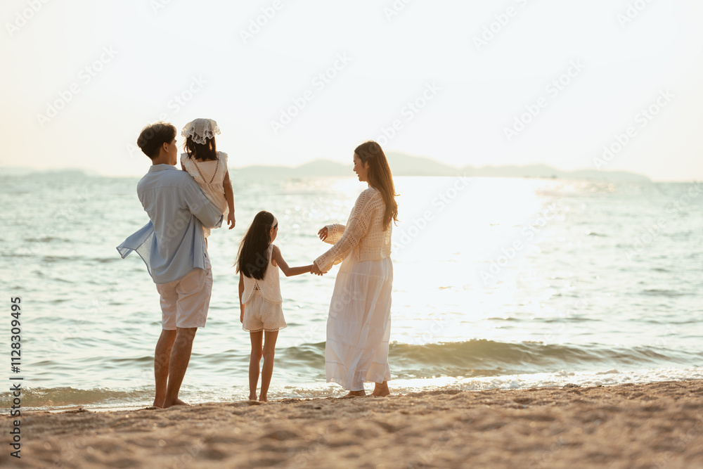 children, parents, parent, family, friends, kids, relaxed, relaxation, father, together. A family of four is standing on the beach. The family is enjoying a day at the beach. children, parents, parent, family, friends, kids, relaxed, relaxation, father, together. A family of four is standing on the beach. The family is enjoying a day at the beach.