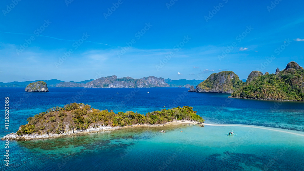 Aerail view of tropical exotic island sand bar separating sea in two with turquoise in El Nido, Palawan, Philippines. Aerail view of tropical exotic island sand bar separating sea in two with turquoise in El Nido, Palawan, Philippines.