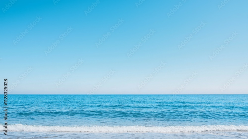 A serene view of a calm ocean under a clear blue sky. A serene view of a calm ocean under a clear blue sky.