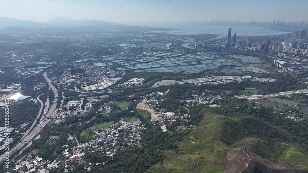 Aerial skyview of Lok Ma Chau Loop showcasing the Hong Kong-Shenzhen Innovation and Technology Park redevelopment near Huanggang Port and the Greater Bay Area economic growth Aerial skyview of Lok Ma Chau Loop showcasing the Hong Kong-Shenzhen Innovation and Technology Park redevelopment near Huanggang Port and the Greater Bay Area economic growth