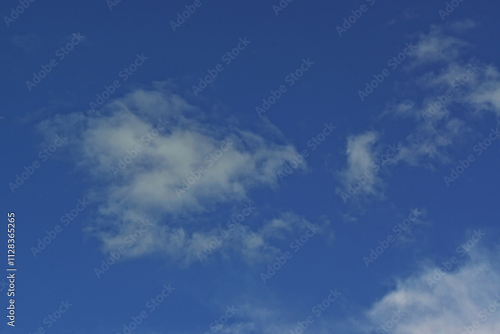 blue sky with light clouds on a warm sunny day blue sky with light clouds on a warm sunny day