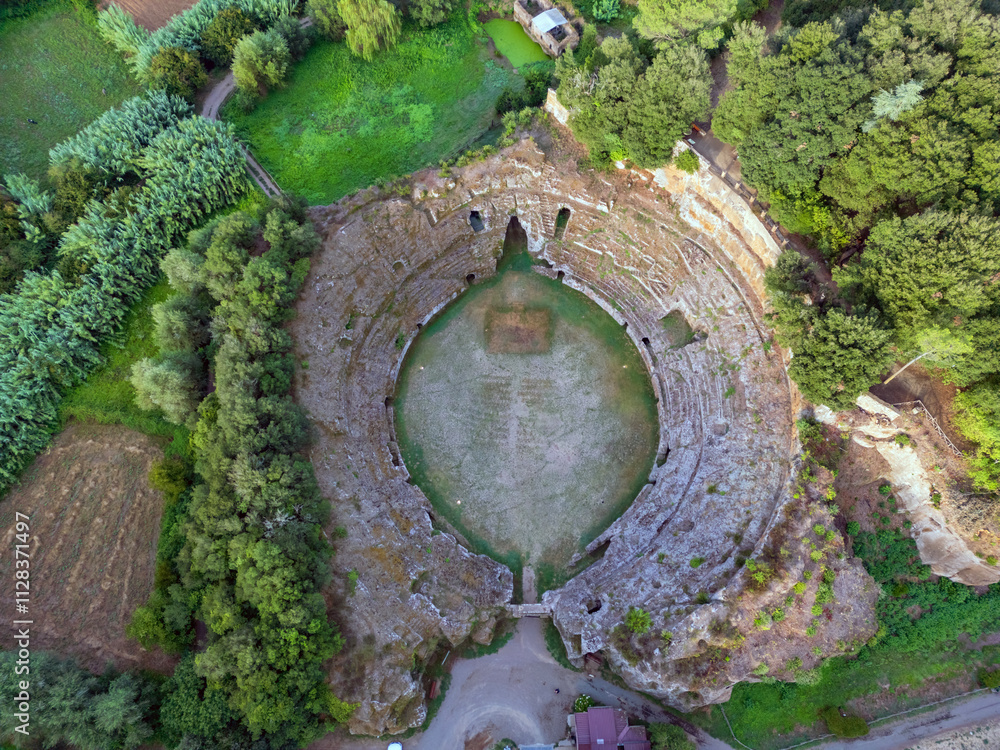 Aerial view of the Roman Amphitheater of Sutri, the history of an ancient landscape and a country.