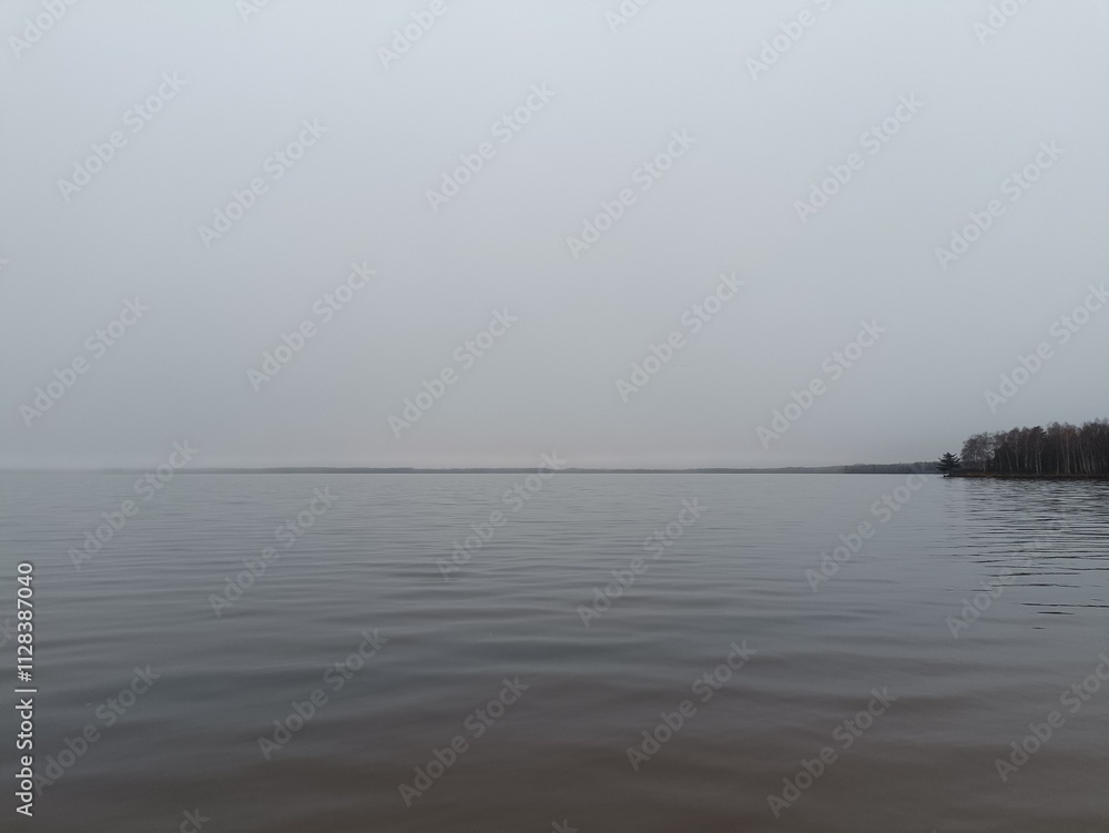 Rekyva lake during cloudy day. Cloudy day with white and gray clouds in sky. Wavy lake. Horizon over water. Rekyvos ezeras.
Rekyva lake during cloudy day. Cloudy day with white and gray clouds in sky. Wavy lake. Horizon over water. Rekyvos ezeras.