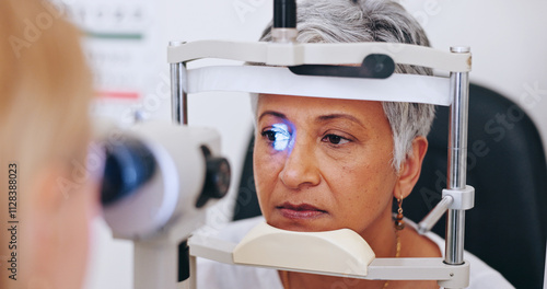 Eye exam, consulting and light with old woman in clinic for optometrist, healthcare and vision. Medical, ophthalmologist and slit lamp with people and equipment for retina, test and assessment